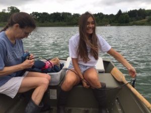 Blog author Olivia Porth sampling phytoplankton and water in a lake near KBS.
