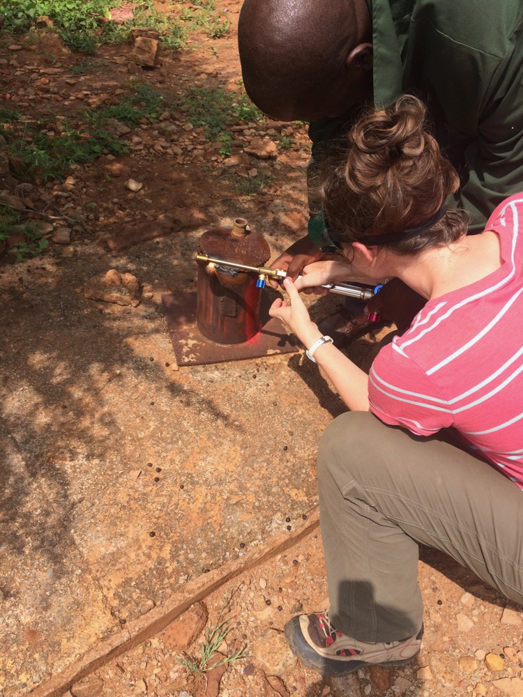 Using an oxyacetylene torch to cut the cap off of a monitoring borehole with the help of Mr. Gaabadzo Mannathoko in Ramotswa. (Photo courtesy of Bonnie McGill)