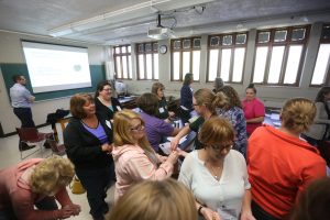Middle & high school teachers participate in a learning activity about greenhouse gases