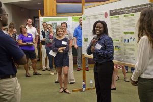 Summer students share their research experience with symposium guests
