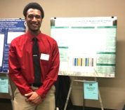 Student presenting research poster