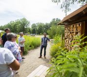 Graduate student Sean Griffin explains the bee condo