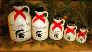 Various sized bottles of maple syrup from the Kellogg Forest
