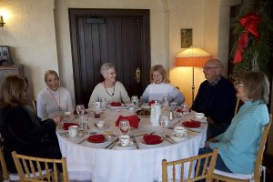 Volunteers enjoy a special tea service at the Manor Houe