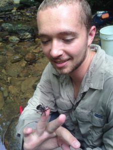 PhD student Kyle Jaynes conducting field work