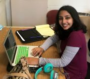 Akshata Rudrapatna works on her laptop in an office at KBS.