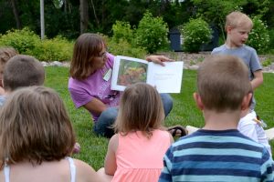 Misty Klotz reads to a group of children at a Wild Wednesdays event.