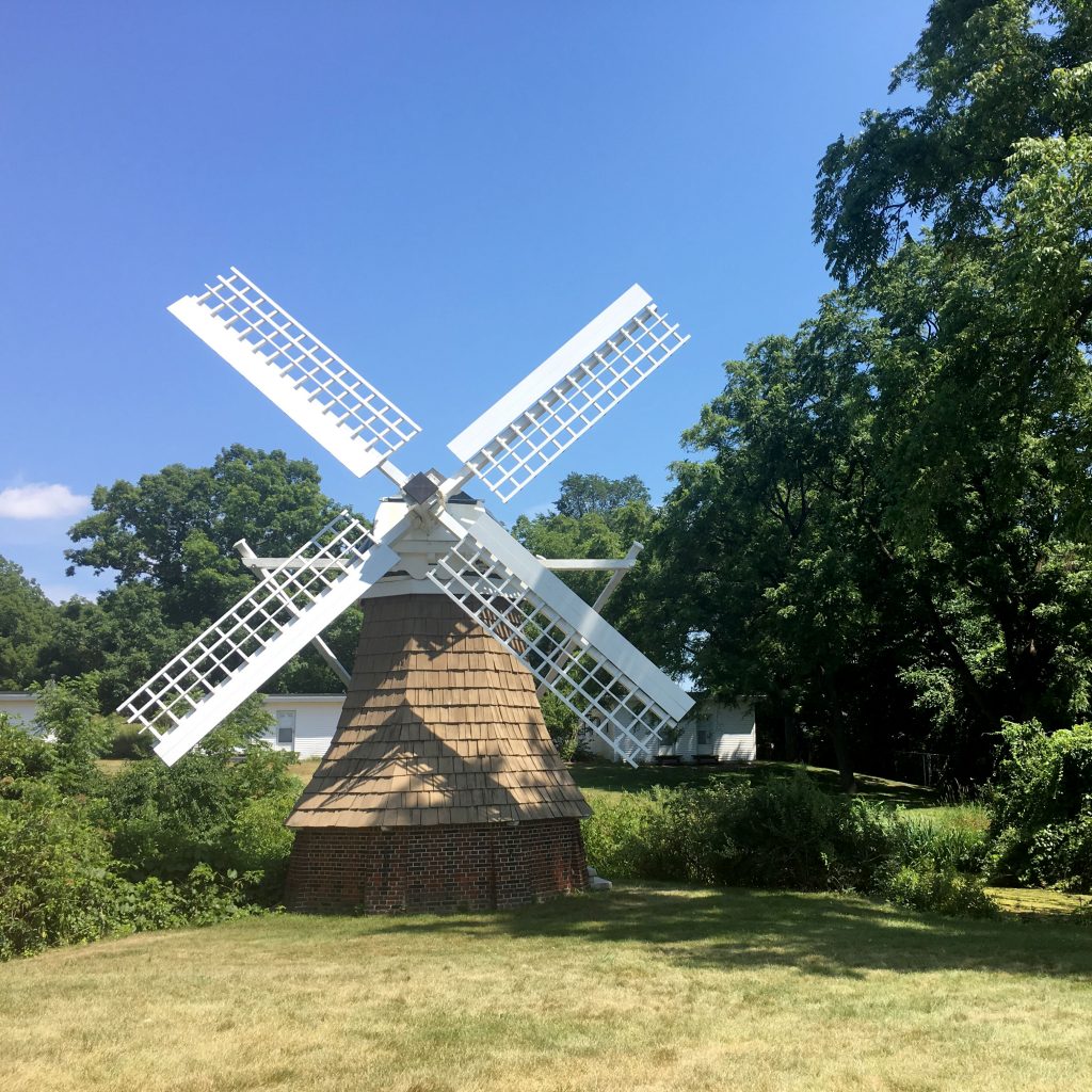 The windmill for which KBS's Windmill Island is named, stands against a blue summer sky.