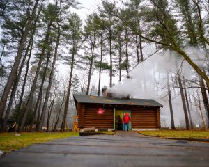 Steam pours from the vented ceiling of the Kellogg Forest sugar shack, also known as Maple Manor, during sugaring season.