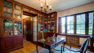 The library in the Kellogg Manor House, featuring wooden built-in bookshelves.