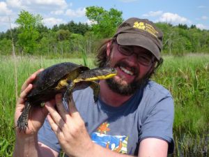 Brendan Reid holds a Blanding's turtle at Sherriff's Marsh.