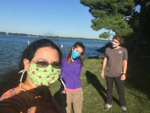 Joelyn de Lima, Elizeth Cinto Mejia and Kyle Jaynes socially distanced, masks on, standing on Windmill Island at Kellogg Biological Station, Gull Lake shore
