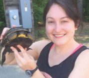 Close-up photo of Jessica Judson holding a turtle.
