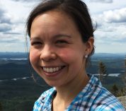 Headshot photo of Cinnamon Mittan against a mountainous backdrop.
