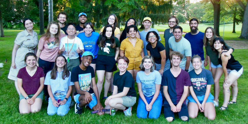A large group of KBS summer undergraduate students pose for a photo on the lawn near the KBS Carriage House.