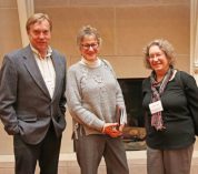 Kay Gross, center, stands with Brian Wilsey and Lynn Clark of Iowa State University.