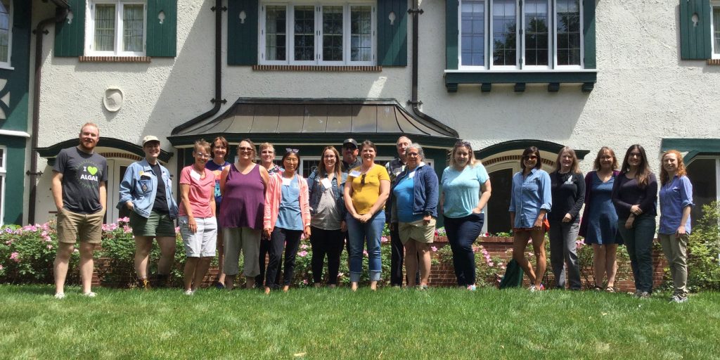 Group photo of KBS K-12 Partnership Summer Algae Institute, standing in front of the Kellogg Manor House.