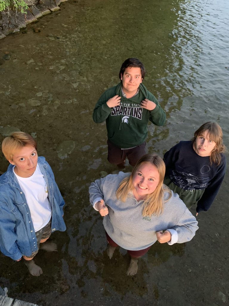 Alex Sills and fellow KBS summer students stand ankle-deep in Gull Lake.