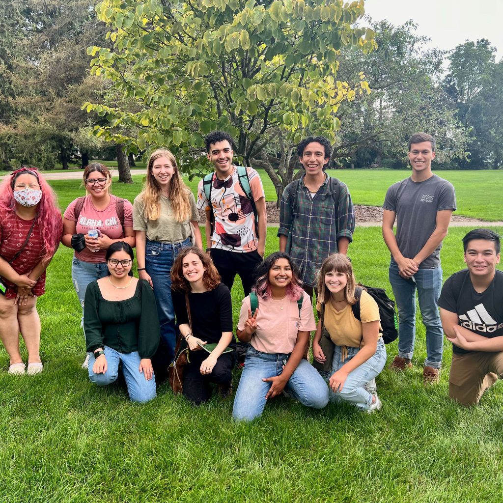 Program co-chair Toby SantaMaria (left) poses with Envision EEB attendees on the grounds of KBS near Gull Lake.
