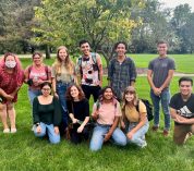 Program co-chair Toby SantaMaria (left) poses with Envision EEB attendees on the grounds of KBS near Gull Lake.