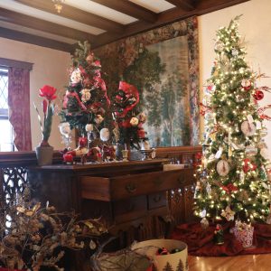 Upstairs landing of the W.K. Kellogg Manor House festively decorated for the holidays with a tree and other items.