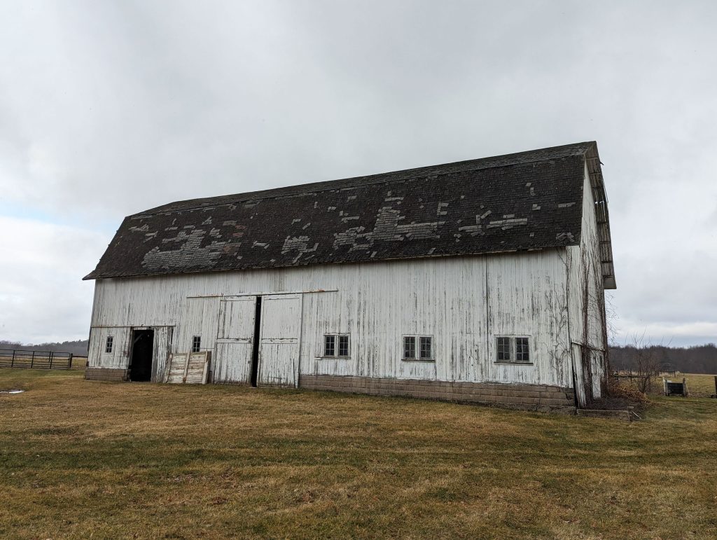 Maggie’s Barn stands in front of a pasture area near the W.K. Kellogg Biological Station Pasture Dairy Center.