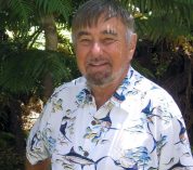 Head shot photo of Dr. Ken Cummins with trees in the background.