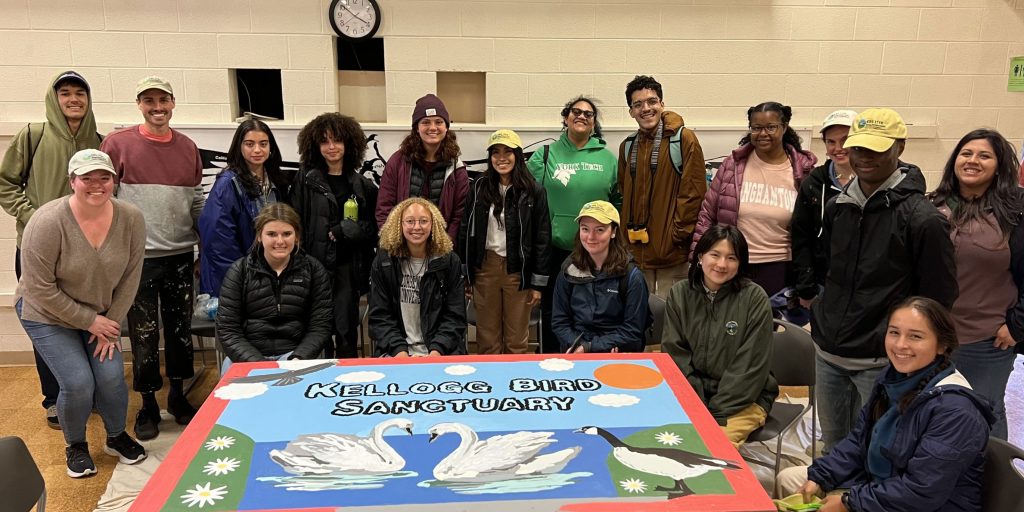 Students in the ESA SEEDS program pose with a paint-by-numbers mural, created by past KBS LTER artists-in-residence Anna Lee Roeder and Eric Vasilauskas.