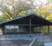 The front of the Overlook Building is shown on an autumn day.