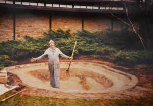 Stu Bassett poses with a shovel in hand after digging what would become the Light Memorial Water Garden at the Bird Sanctuary.