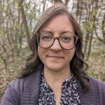 Head shot photo of Cara LaLumia Barnes with a wooded background.