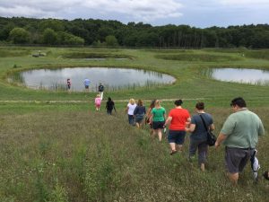 A group of educators heads down to the KBS Pond Lab as part of a KBS K-12 professional development event.