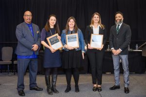 Kara Haas poses with fellow awardees and others after receiving the Graduate Student Award for Community Engagement Scholarship.