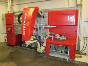 The KBS Pasture Dairy Center robotic milking machine, a large, bright red piece of equipment.