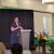 Sarah Reimer speaks from a podium during the ceremony honoring 2024-25 Jack Breslin Distinguished Staff Award recipients.