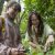 Two BioBlitz participants smile while pointing at a plant.