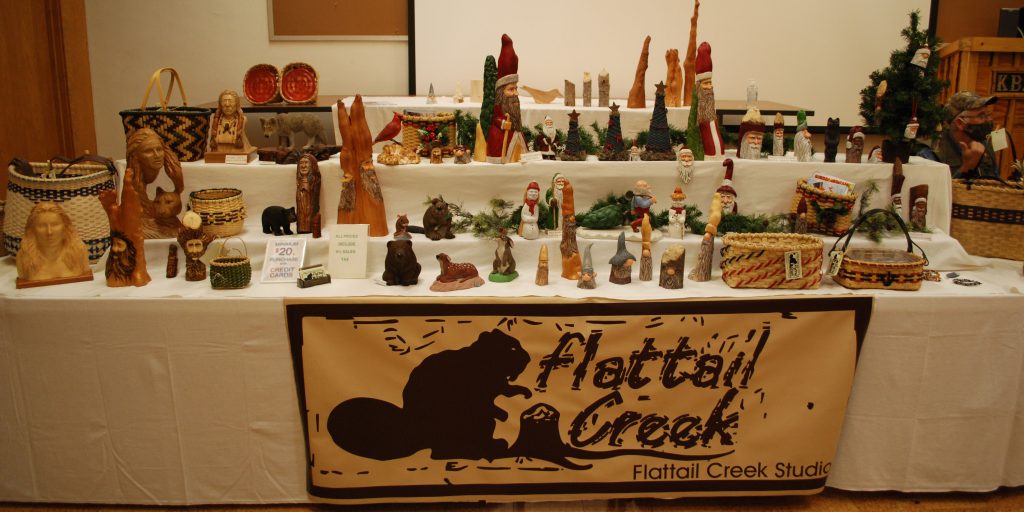 A table featuring Flattail Creek Studio is set up in the W.K. Kellogg Bird Sanctuary's auditorium during a previous Arts and Eats Tour weekend.