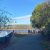People gather off the W.K. Kellogg Bird Sanctuary's Paved Path on the shore of Wintergreen Lake to view birds on an autumn day.