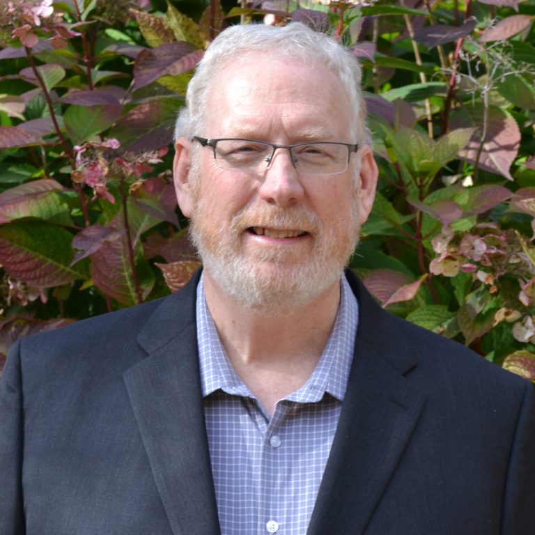 Professional headshot of Bryan Foster outdoors