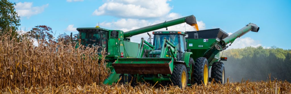 A combine harvests corn from a field at the W.K. Kellogg Biological Station.