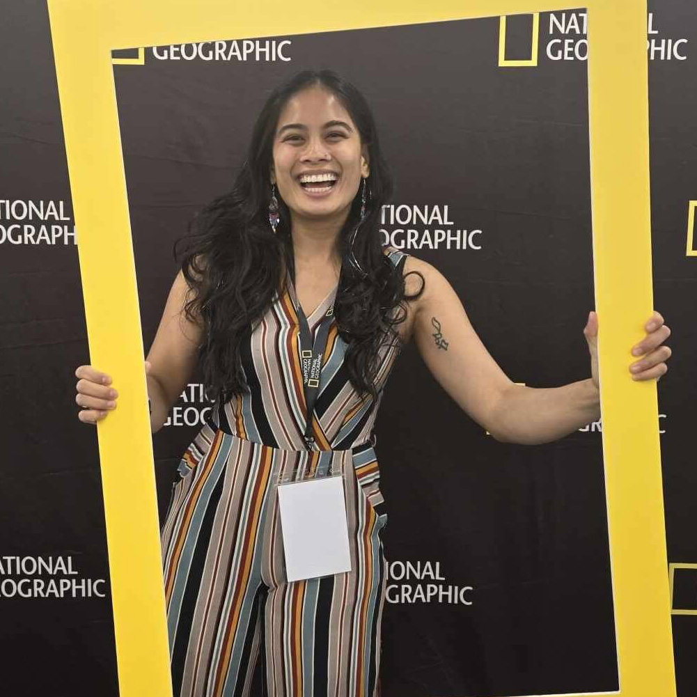 Photo of Kirsten Salonga posing inside a selfie frame with a National Geographic backdrop.