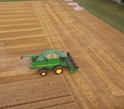 A combine works an agricultural field at the KBS Long-Term Ecological Research program site.