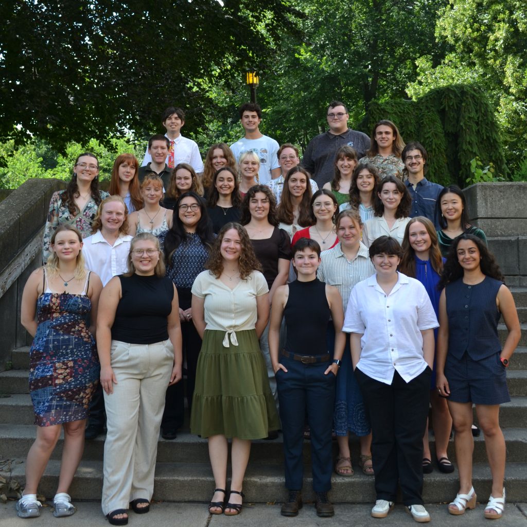 Group photo of KBS summer undergraduate students, taken on an outdoor staircase.