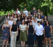 Group photo of KBS summer undergraduate students, taken on an outdoor staircase.