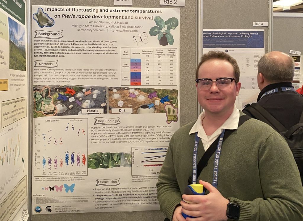 KBS graduate student Sam Stynen stands next to his research poster during a session at the British Ecology Society Conference in Edinburgh, Scotland, in winter 2025.